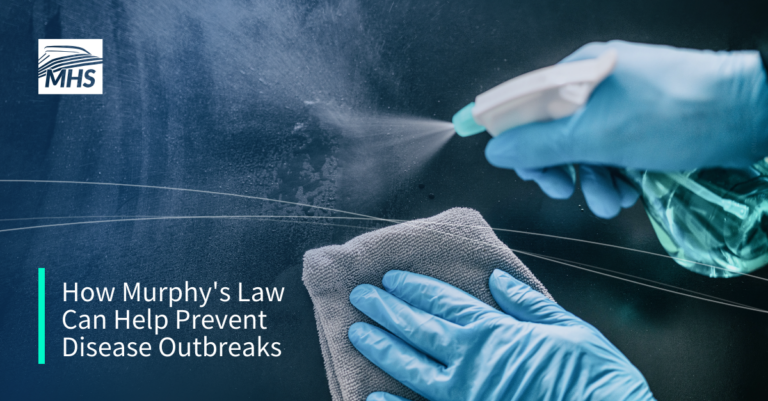 Photo of gloved hands sanitizing a surface, with the words, How Murphys Law Can Help Prevent Disease Outbreak.