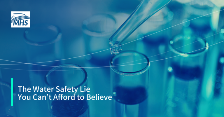 An image of a pipette dropping a clear liquid sample into a test tube, with the words, The Water Safety Lie You Can’t Afford to Believe
