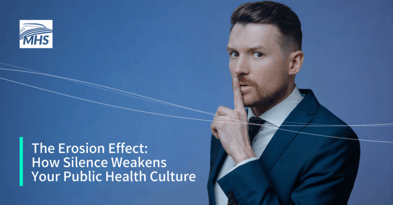 A young businessman in a suit with a finger over his mouth indicating not to speak, with the words, The Erosion Effect How Silence Weakens Your Public Health Culture